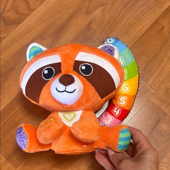 Orange and Blue Stuffed Raccoon Toy with Cartoonish Design - Picture 8 of 8